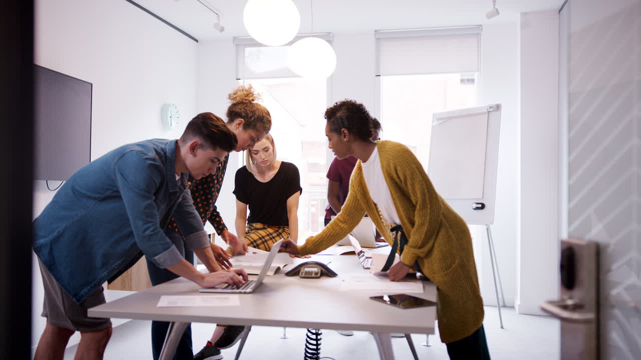Young creative business team brainstorming in a meeting room, selective focus