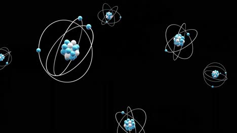 animación de modelos de átomos que giran sobre un fondo negro