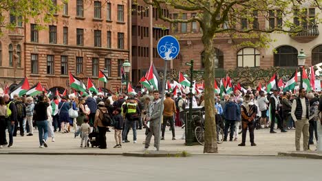 pro palestine protesters march against israel’s eurovision participation in malmö (sweden), calling for a ceasefire on the war in gaza, eurovision song contest 2024, wide handheld shot