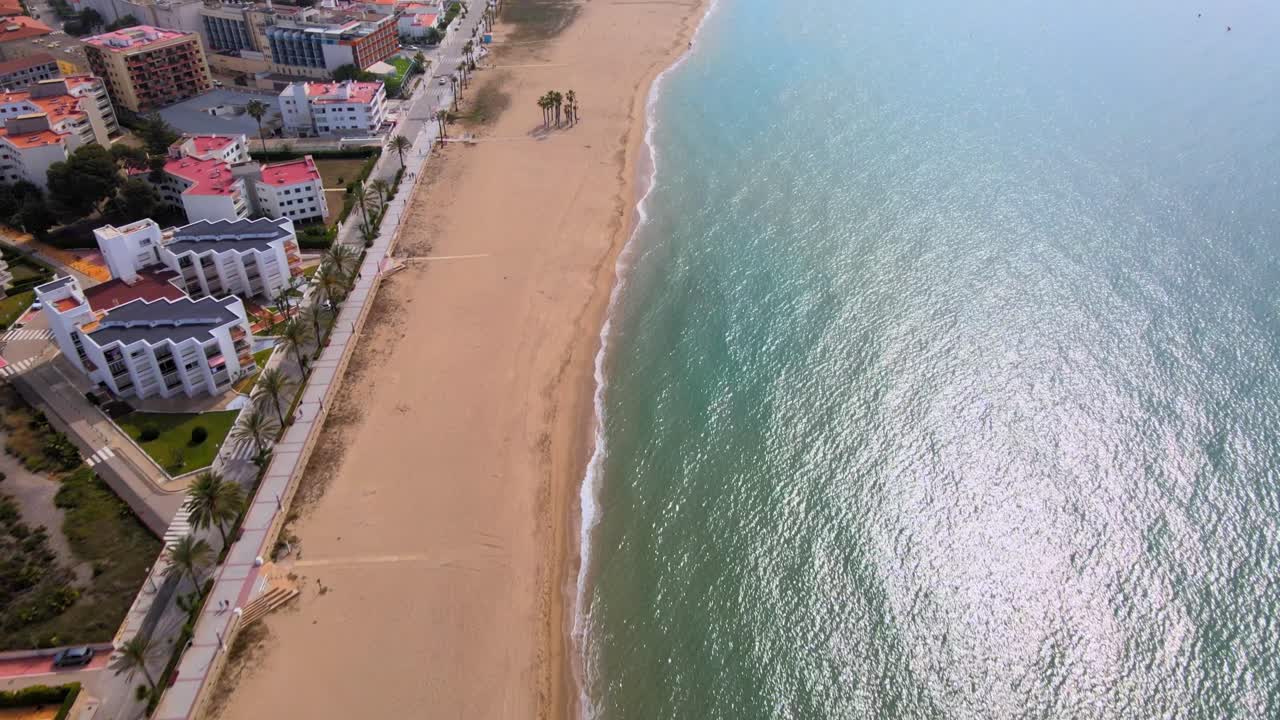 Aerial 4K drone footage of blooming Coma-Ruga in spring, showcasing vibrant trees in different stages of bloom, a picturesque display of nature's rejuvenation