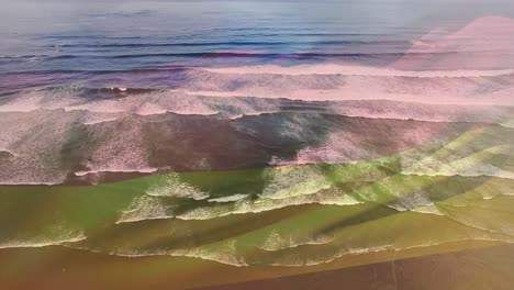 composición digital de agitar la bandera de alemania contra la vista aérea de las olas del mar
