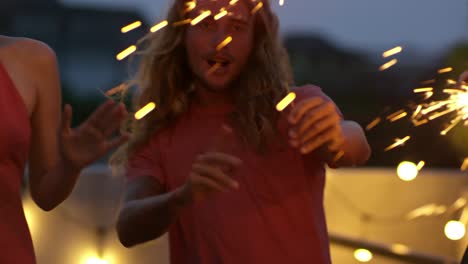 friends dancing with sparklers