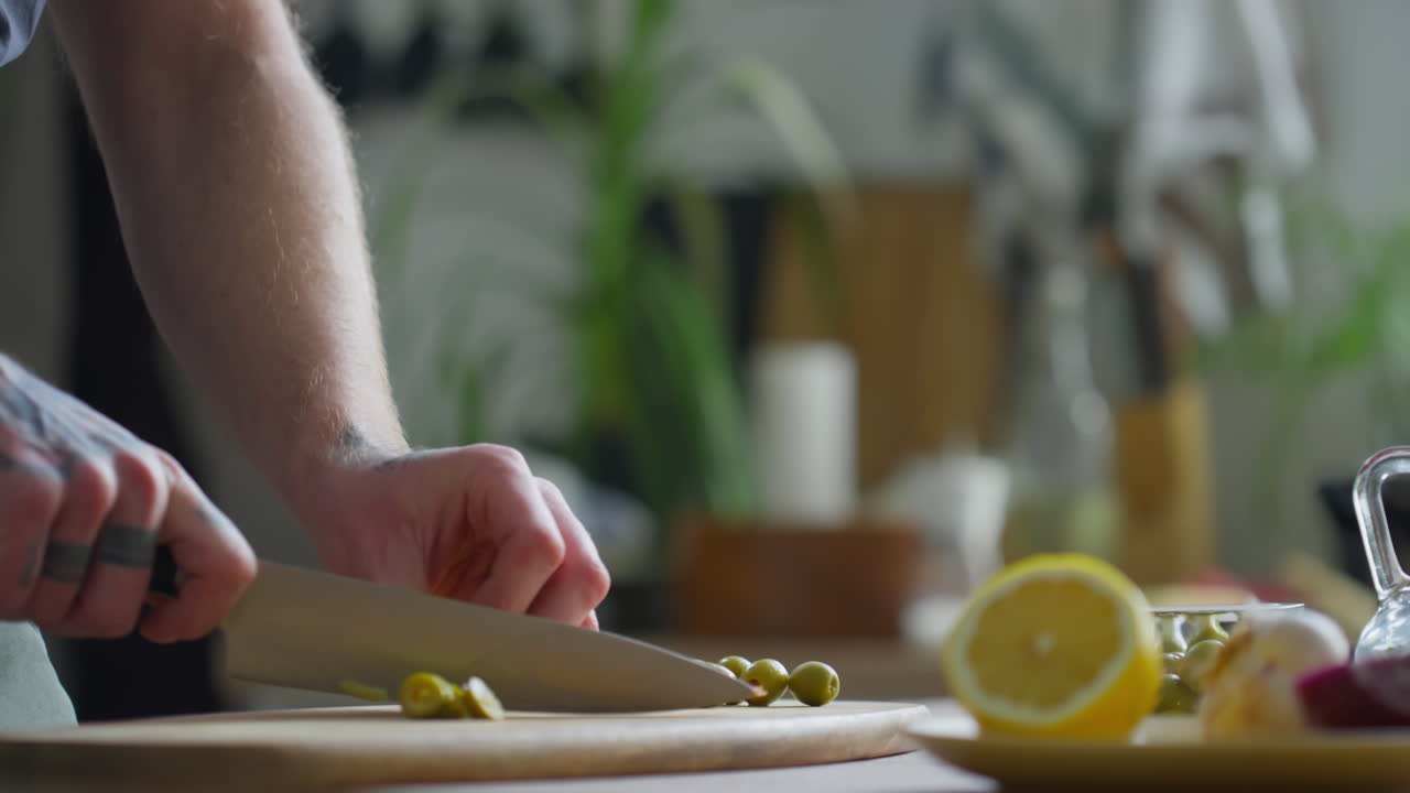 Chef Cutting Green Olives