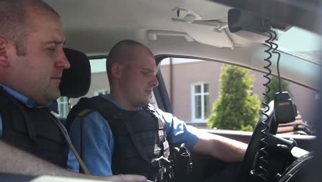 police officers in a car