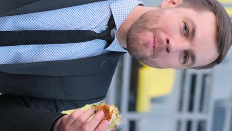 a girl is eating a hamburger closeup a girl is eating a hamburger closeup