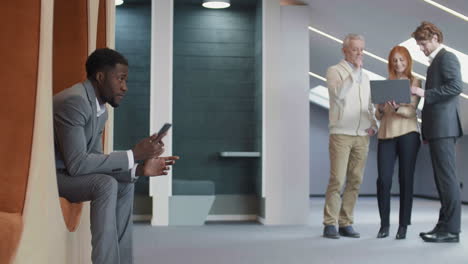 multiethnic businesspeople in hall of business center