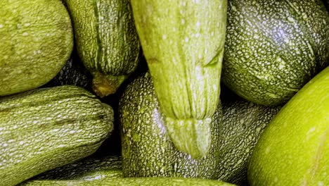 a vibrant display of fresh courgettes at a local farmers market, highlighting organic, healthy, and nutritious produce perfect for vegetarian and farm-to-table lifestyles.