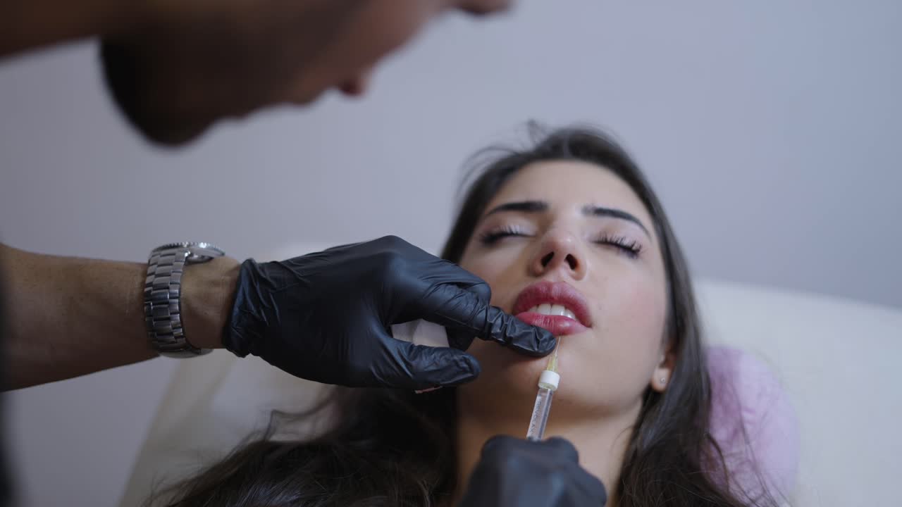 Woman Undergoing Lip Filler Cosmetic Procedure