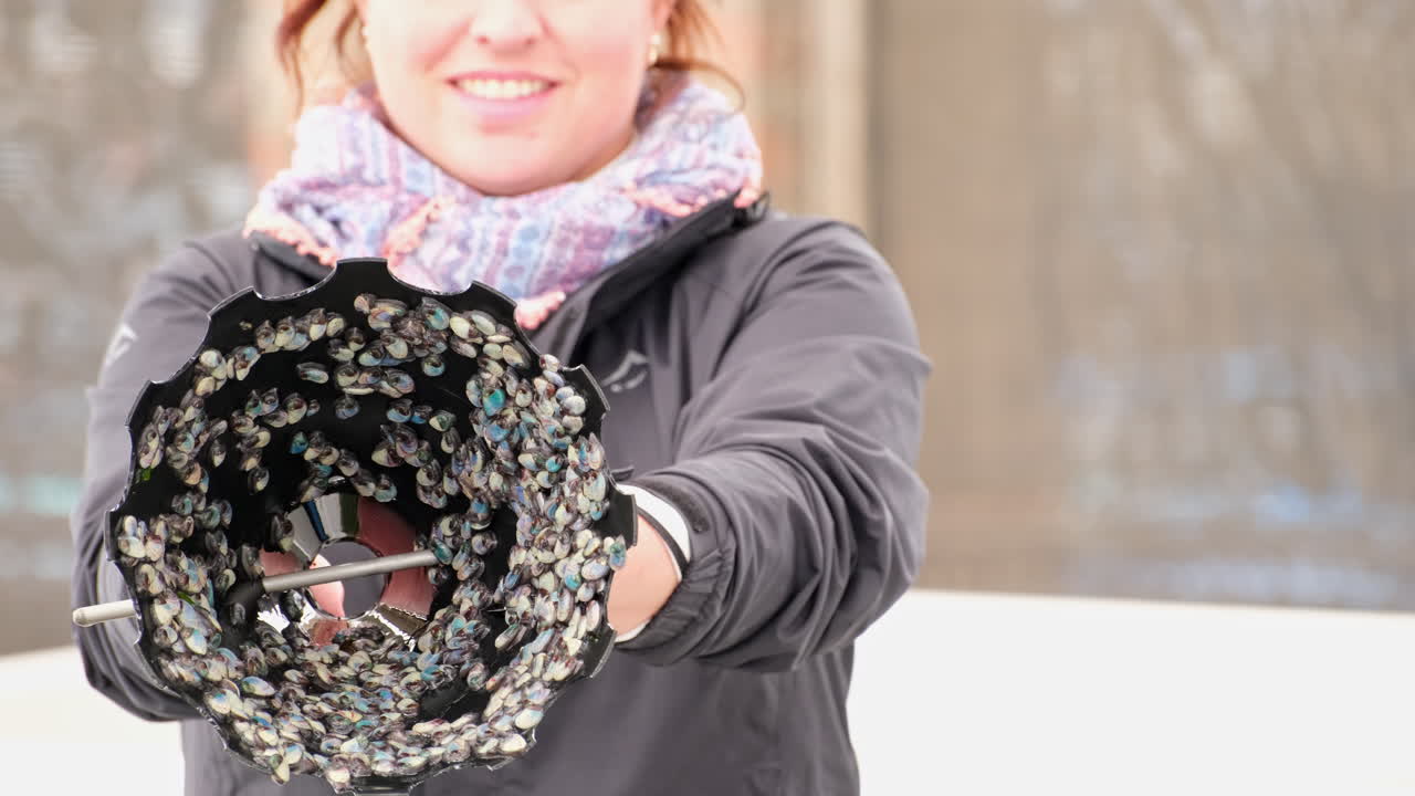 Woman Scientist Holding Mussels Sample for Environmental Research