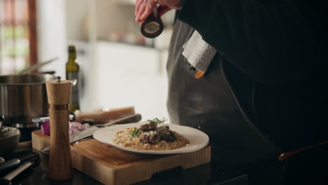 chef preparing mushroom risotto