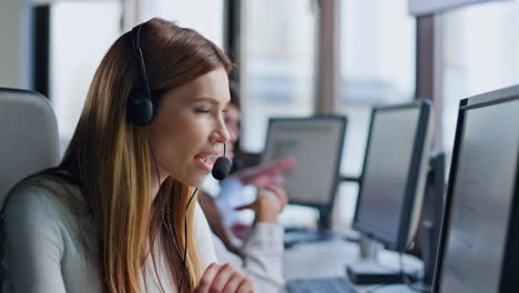 call operator looking computer screen in office. smiling saleswoman manager