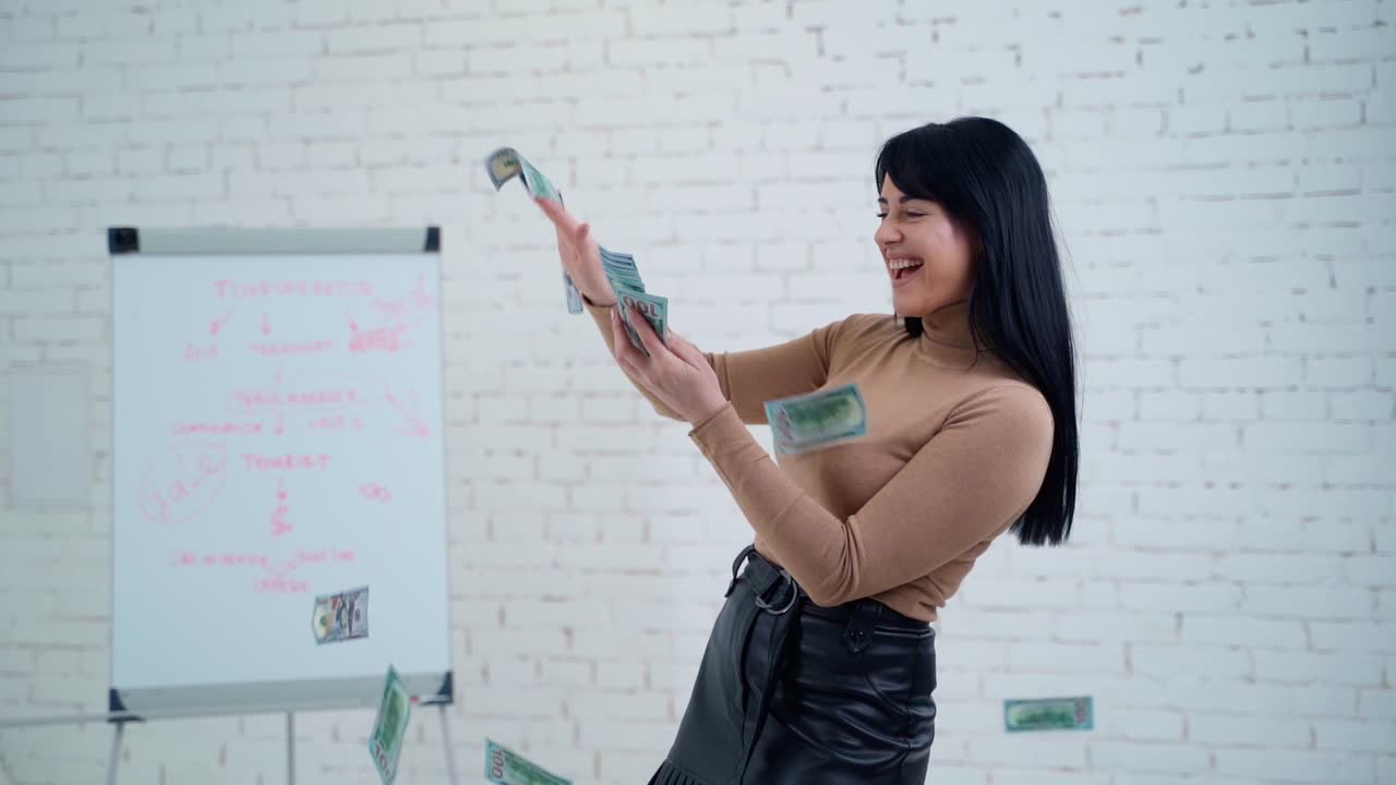 Young woman holding dollars. Portrait of happy young woman throwing out money banknotes