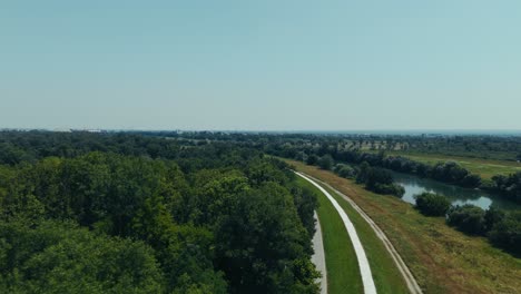 aerial shot of cycling path along the Sava River near Zagreb Croatia surrounded by forest and fields