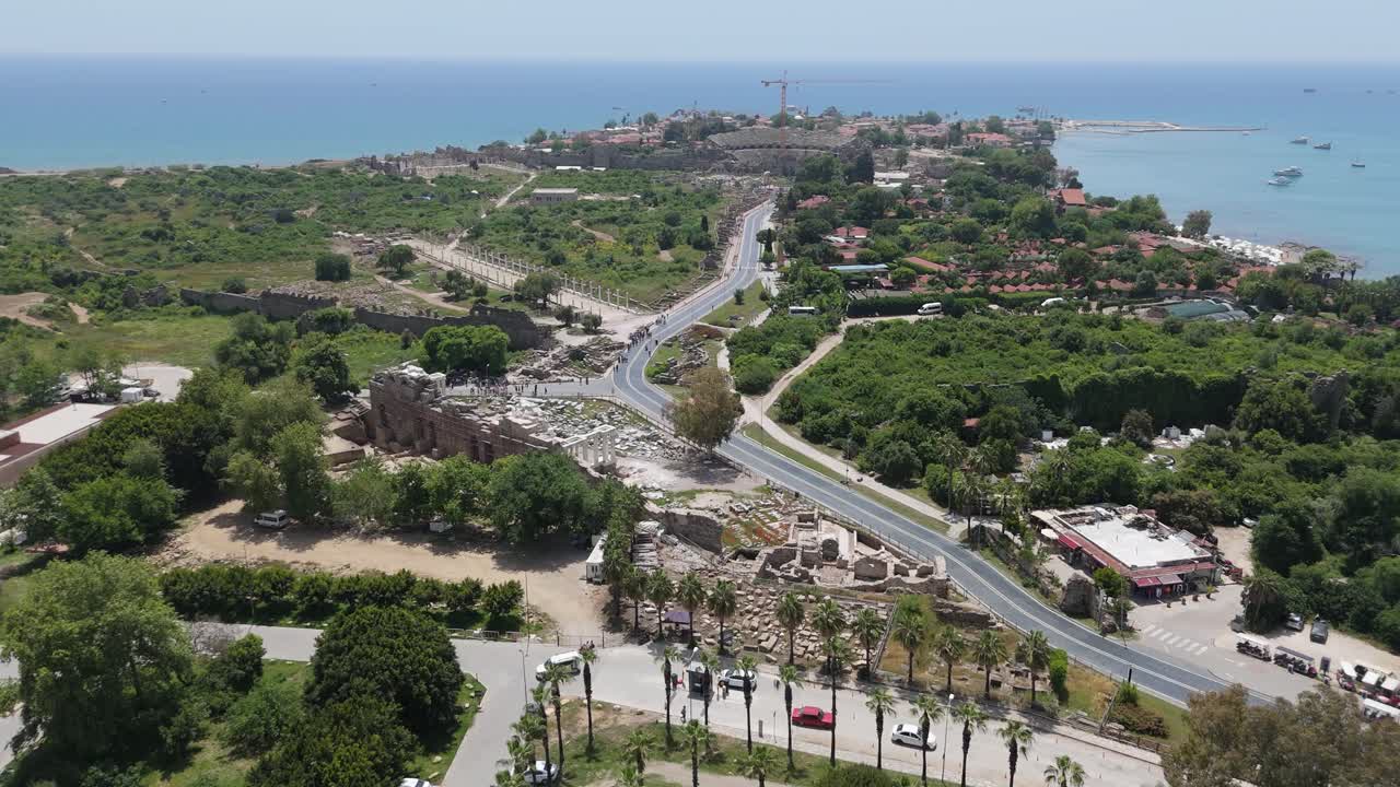 Aerial View Ruins of the Ancient City of Side in Antalya Province on the Mediterranean Coast. Old Statues in the State Agora. The Fragments of Ancient City Wall Bas Relief, Columns Antique Theater 4K