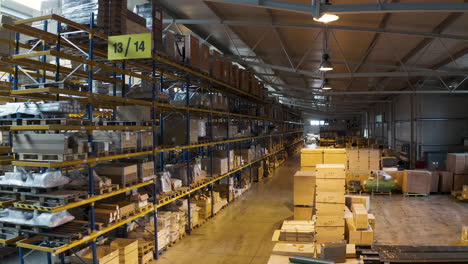 warehouse area 13 and 14 with packed boxes stacked in shelves,aerial