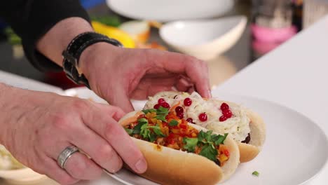 chef preparing hot dogs