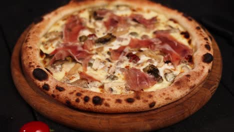 delicious prosciutto and mushroom pizza