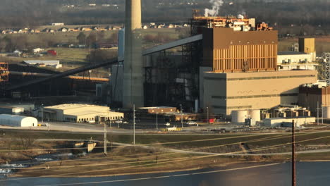 Golden-hour-view-of-Flint-Creek-Power-Plant-by-Lake-Swepco,-Arkansas-with-calm-water-and-clear-skies