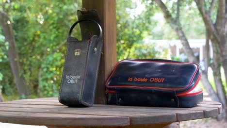 slow motion orbiting shot of a selection of obut bowl bags on a table