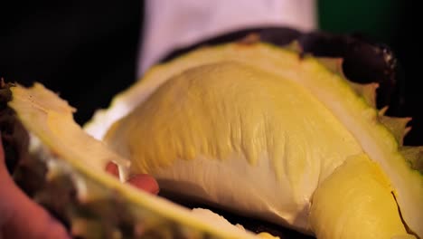 hand open, peel durian, close up