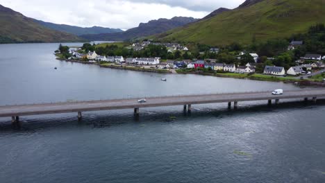 eilean donan castle on loch long near dornie, west coast of scotland, scottish highlands - aerial drone 4k hd footage rise up