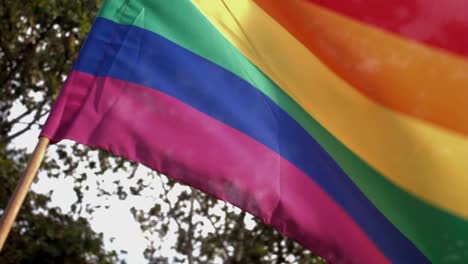 rainbow flag waving in the wind as seen in madrid