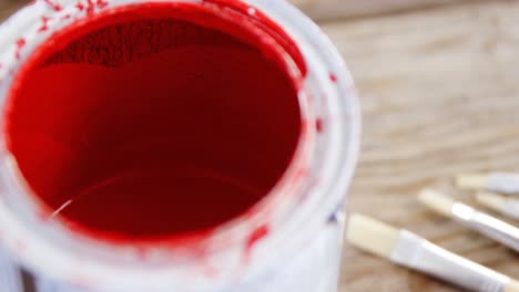 close-up of paint can and paint brushes