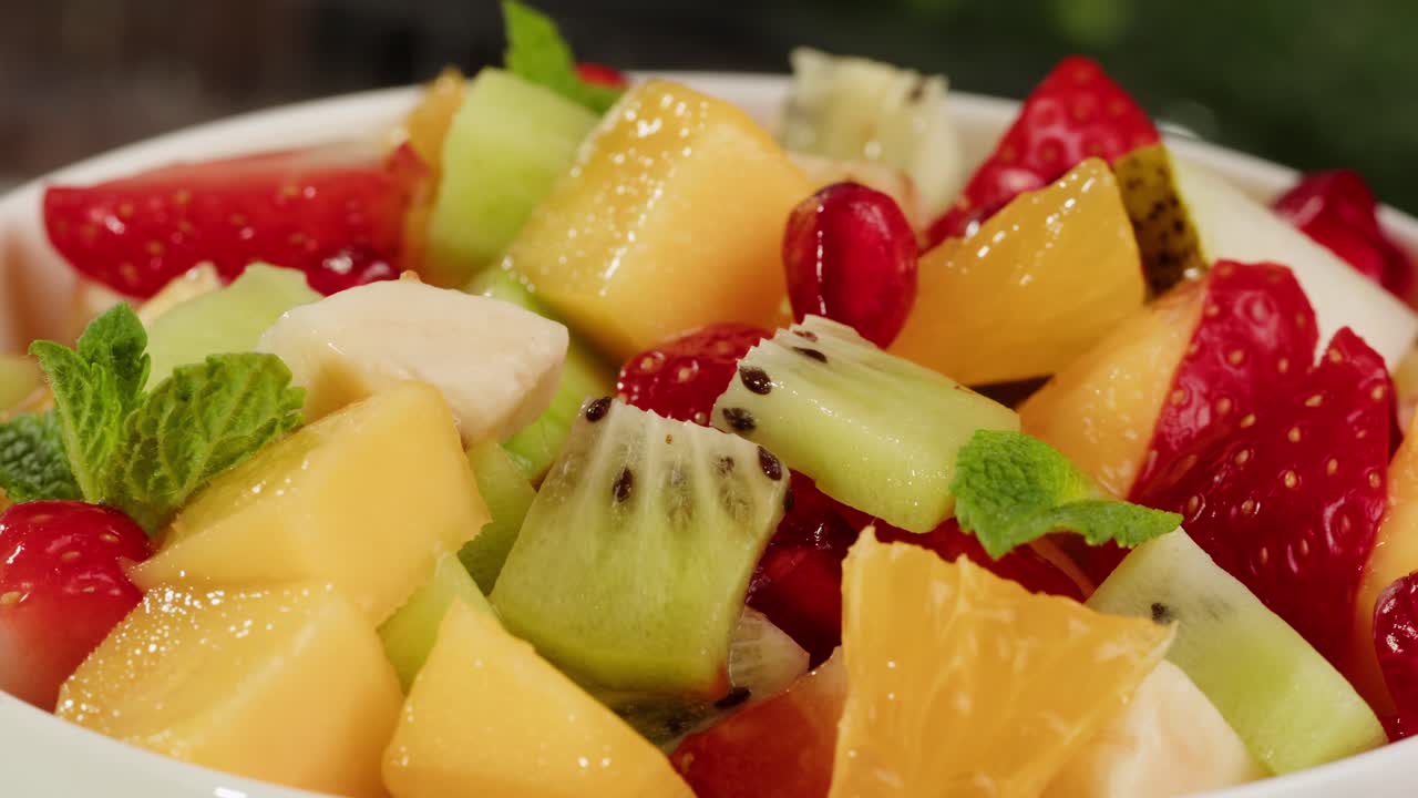 Close-up of Fresh Diced Fruit Salad with Mint