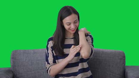 happy indian girl removing the bandage green screen