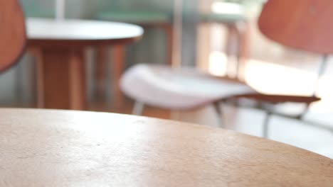 modern cafe interior with smartphone on table