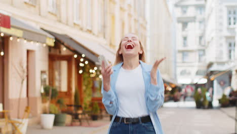 happy woman using mobile smartphone celebrating win good message news lottery casino jackpot victory