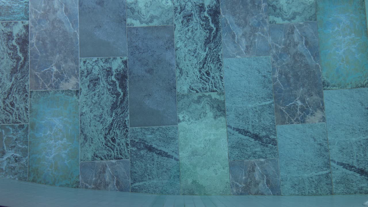 Blue ceramic tile on wall texture background or blue mosaic tile in modern swimming pool