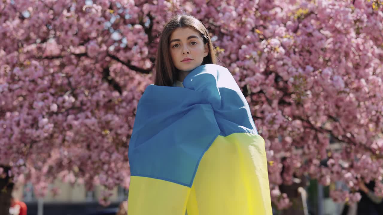 Woman with Ukraine Flag in Springtime