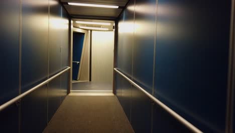 walking down an empty jet bridge