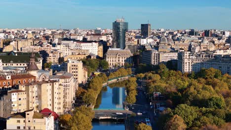 Cinematic Aerial View Over D&acirc;mbovița River with Bucharest City Skyline in the Background, Izvor District, Romania