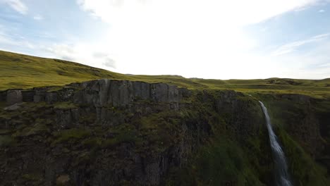 FPV-shot-along-the-seljalandsfoss-waterfall-ridge-line-and-diving-in-Iceland