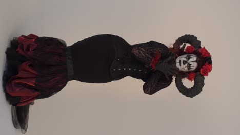 catrina cosplay girl moving slowly and hypnotizing you in a light background, full shot