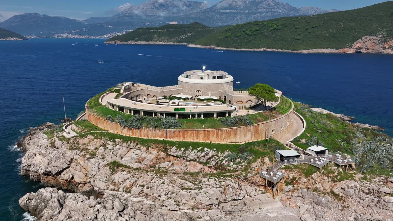 Fort on Mamula Island, sea and coast in Montenegro, aerial pull-out