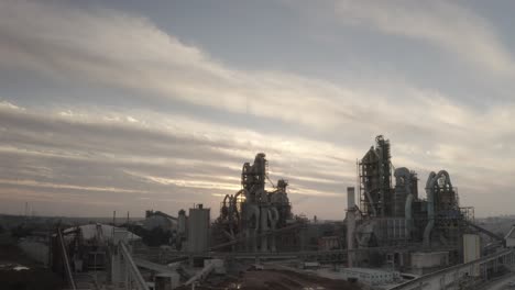 cement factory at sunset