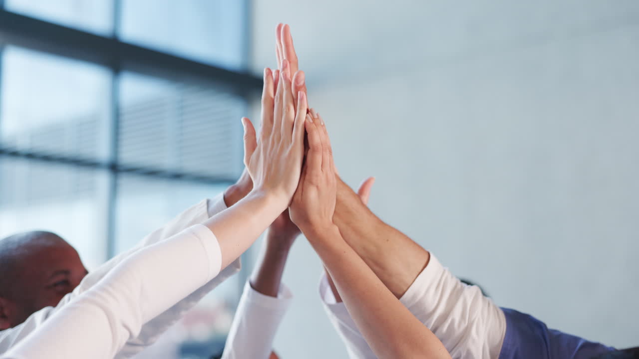 Diverse Business Team Celebrating Success with a Group High Five