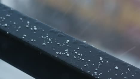 snow on a metal railing