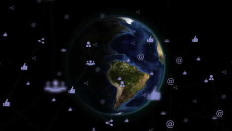 Animation-of-network-of-digital-icons-over-spinning-globe-against-black-background