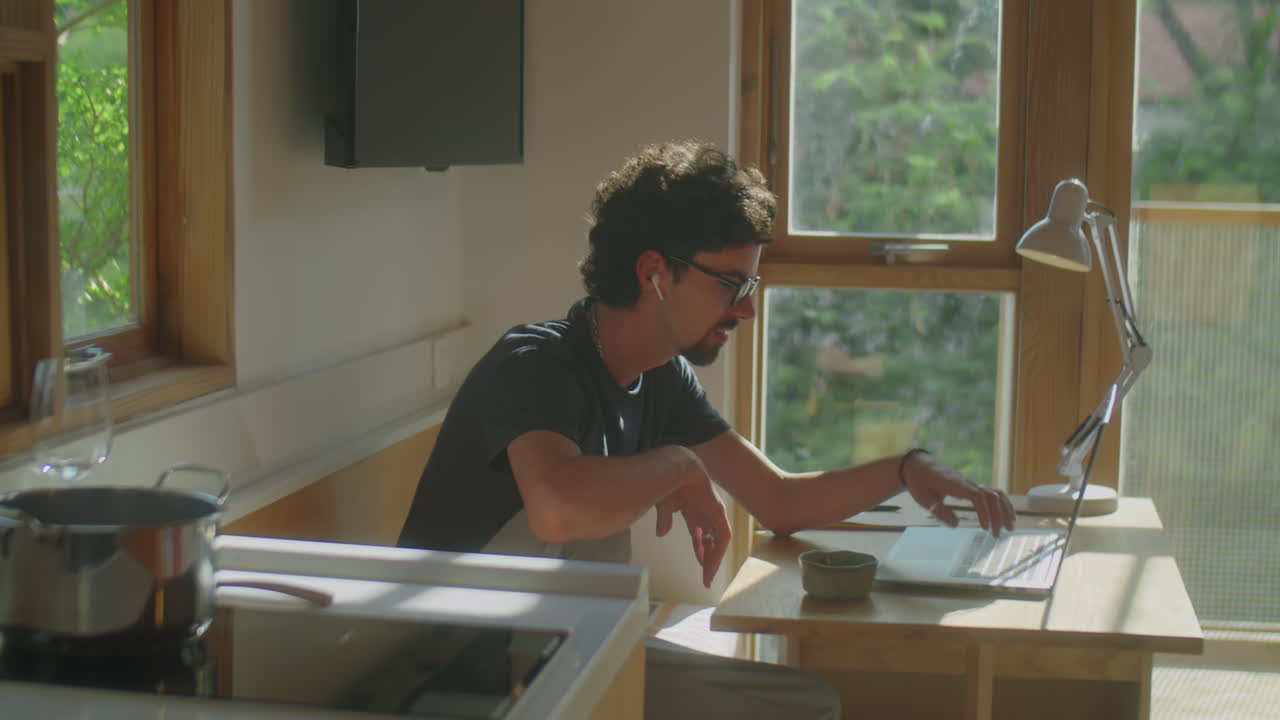 Man Video Calling on Laptop at Home