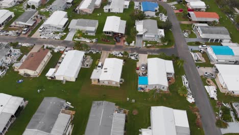 4k drone video of roof tarps on mobile homes damaged by hurricane ian in north port, florida - 25