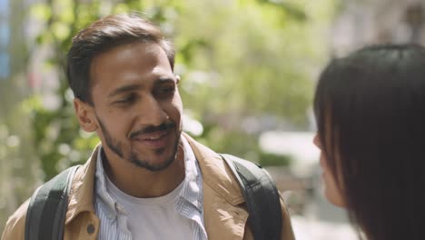 close up of muslim couple on date meeting on city street 2