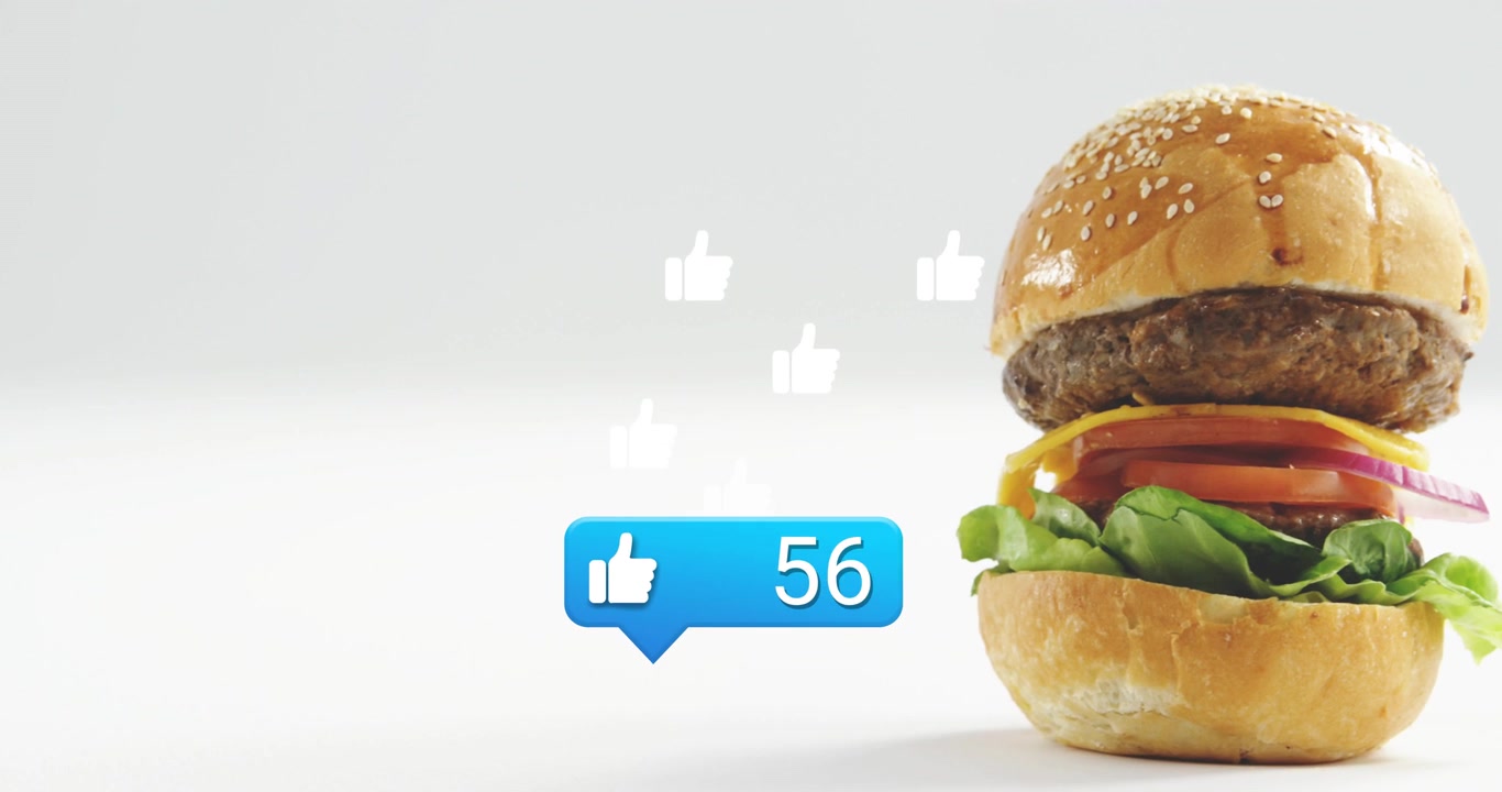 Blue bubble appearing, counter updating and thumbs-up floating, burger sliding center to show likes