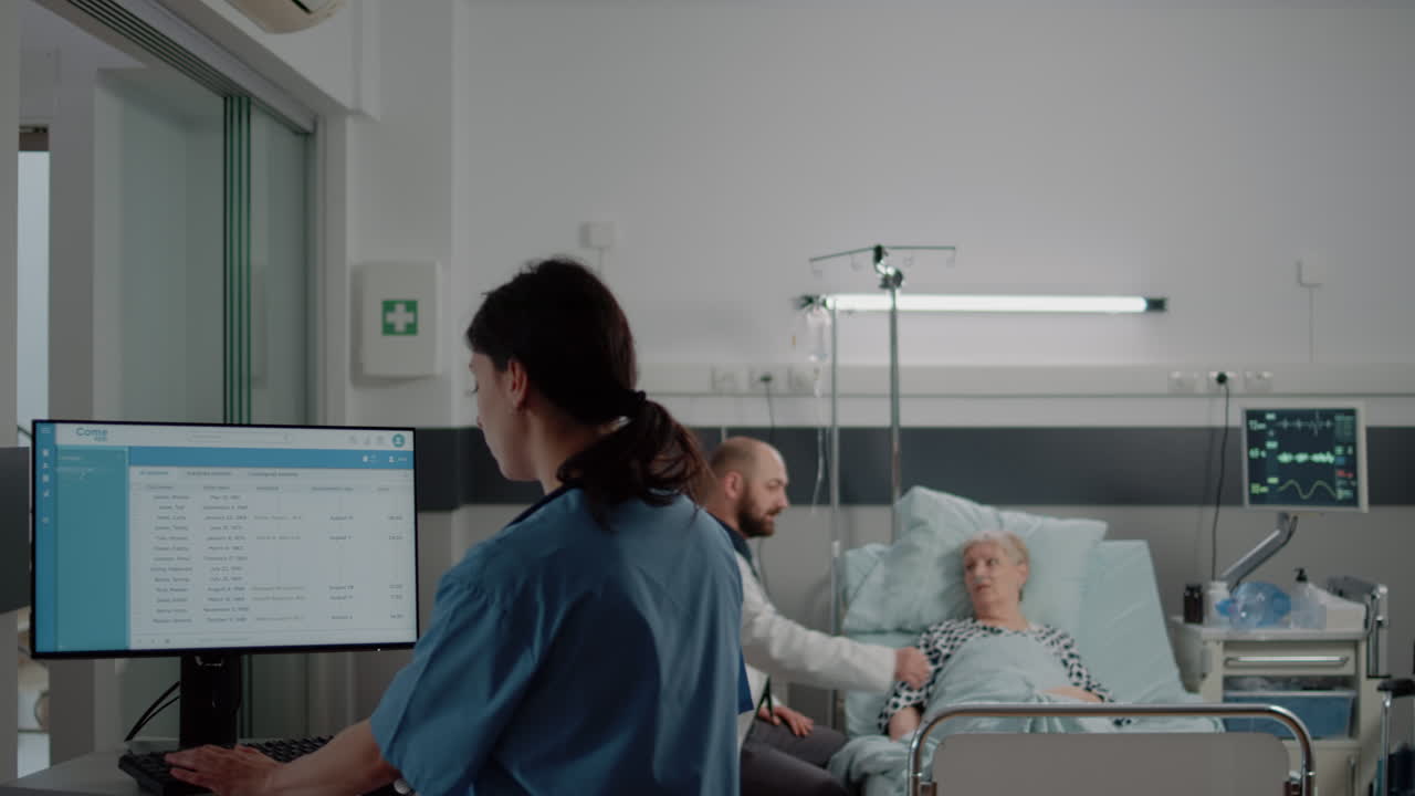 Woman working as nurse and looking at computer with files