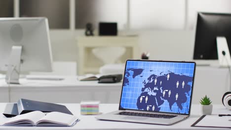 empty modern office with computers and laptop with digital world map and icons on screen