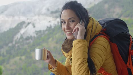 Hiker-talking-on-phone-during-a-break