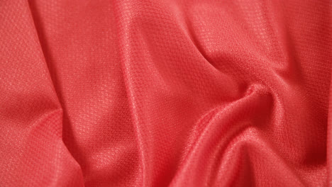 close-up of football red jersey fabric 4k